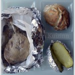 Recette-Cuisse de canard confite en papillote servi avec une pomme de terre au four et un petit pain